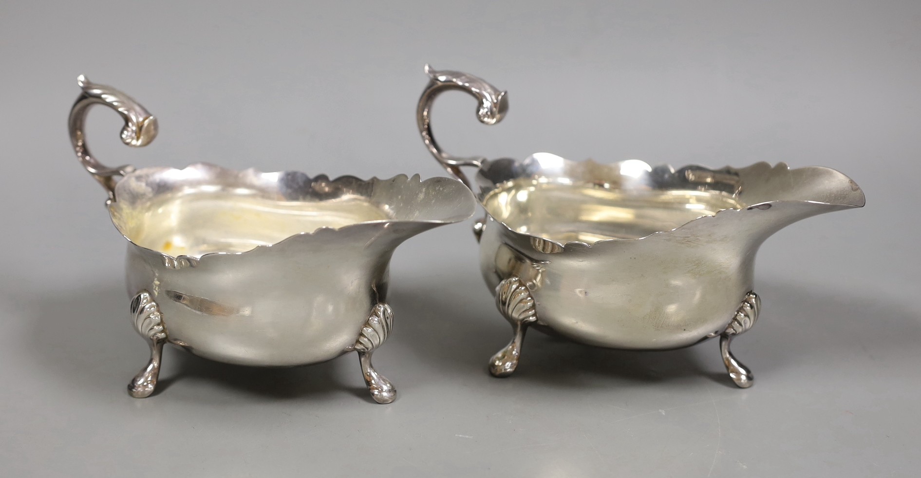 A pair of George V silver oval sauceboats, by Wilson & Gill, London, 1935/6, 15.9oz.